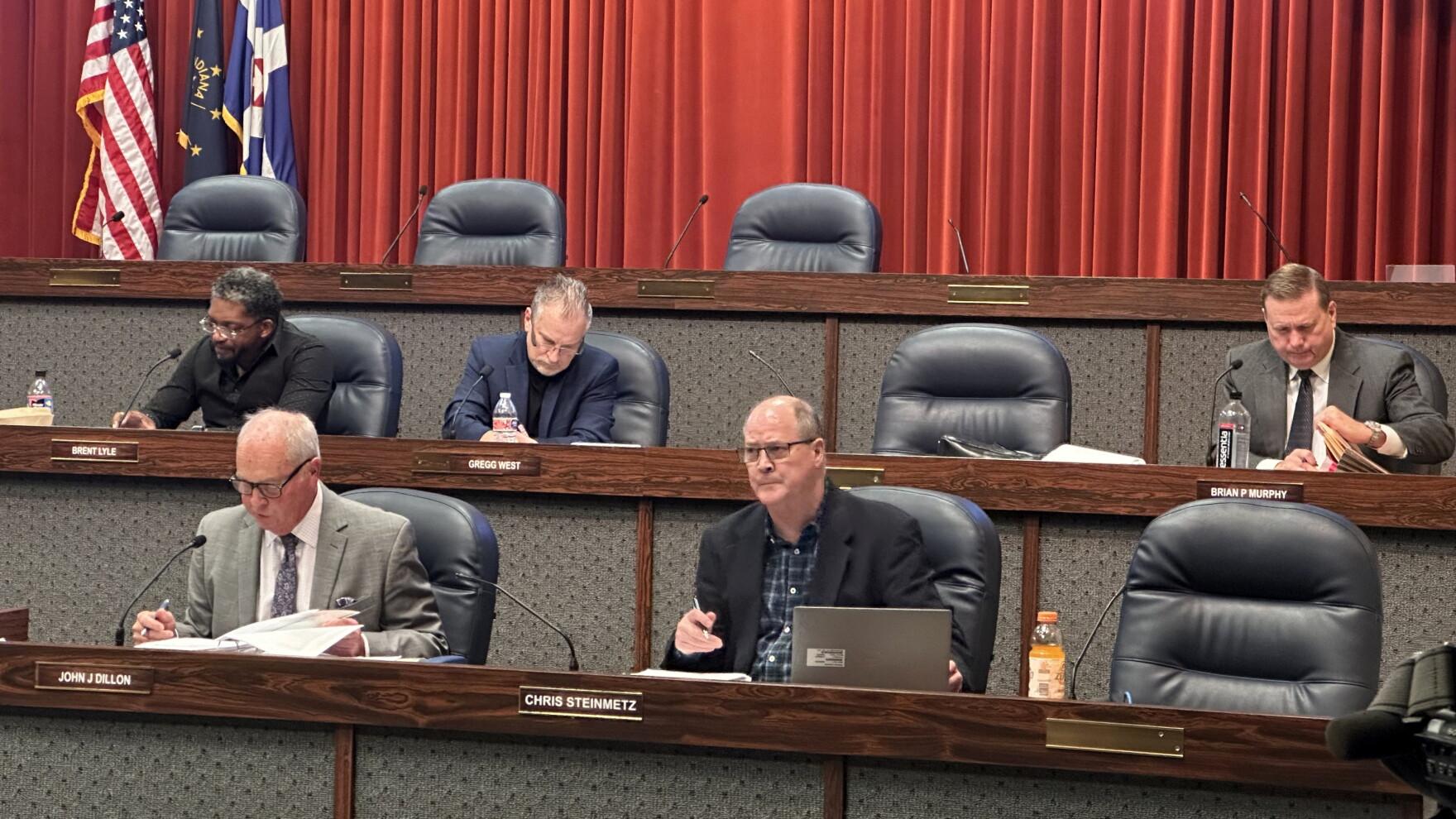 Members of the Metropolitan Development Commission seated at the hearing dais.